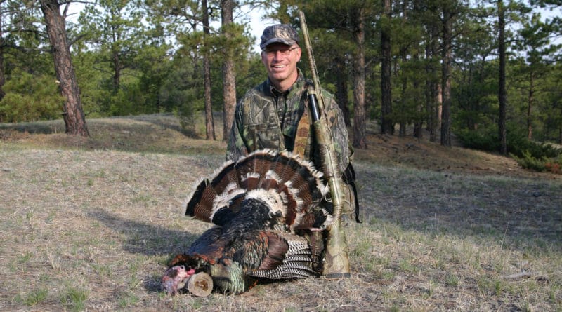 Hunter with wild turkey
