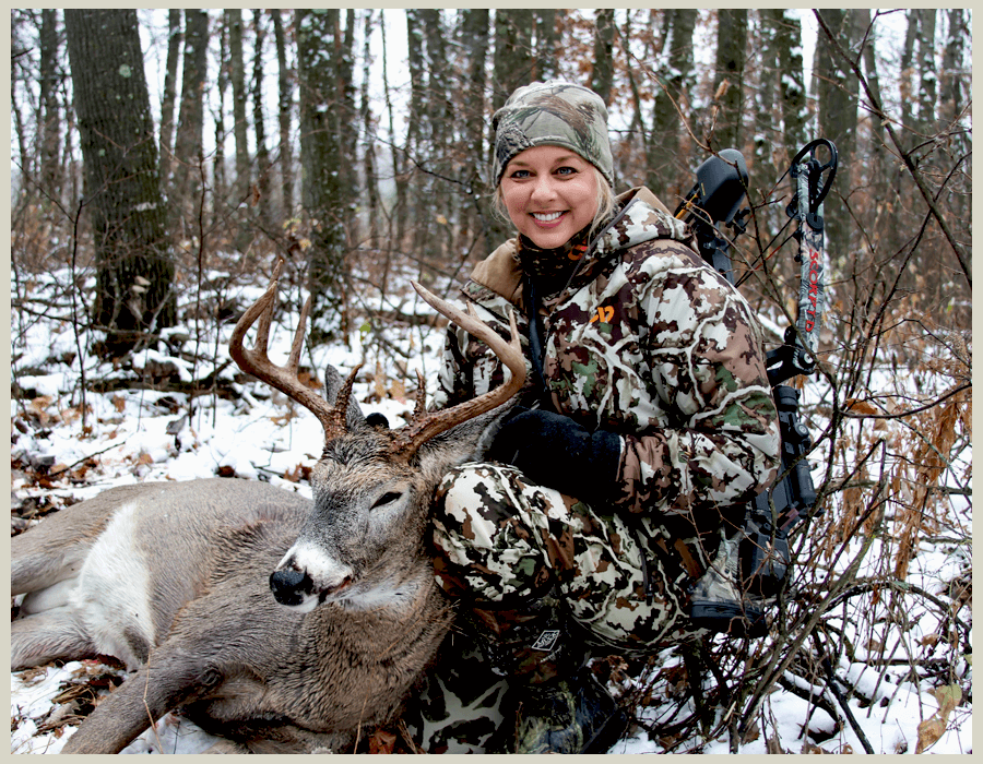 A women hunter with whitetail deer
