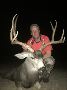 A hunter with a texas mule deer
