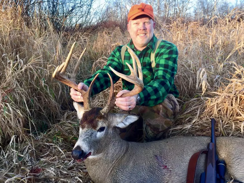 hunter with whitetail deer