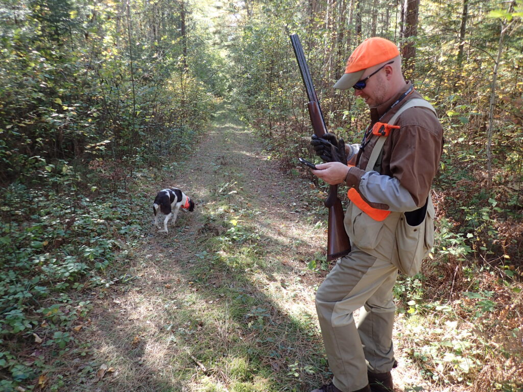 Hunter using onX Hunt app while grouse hunting in northern MN