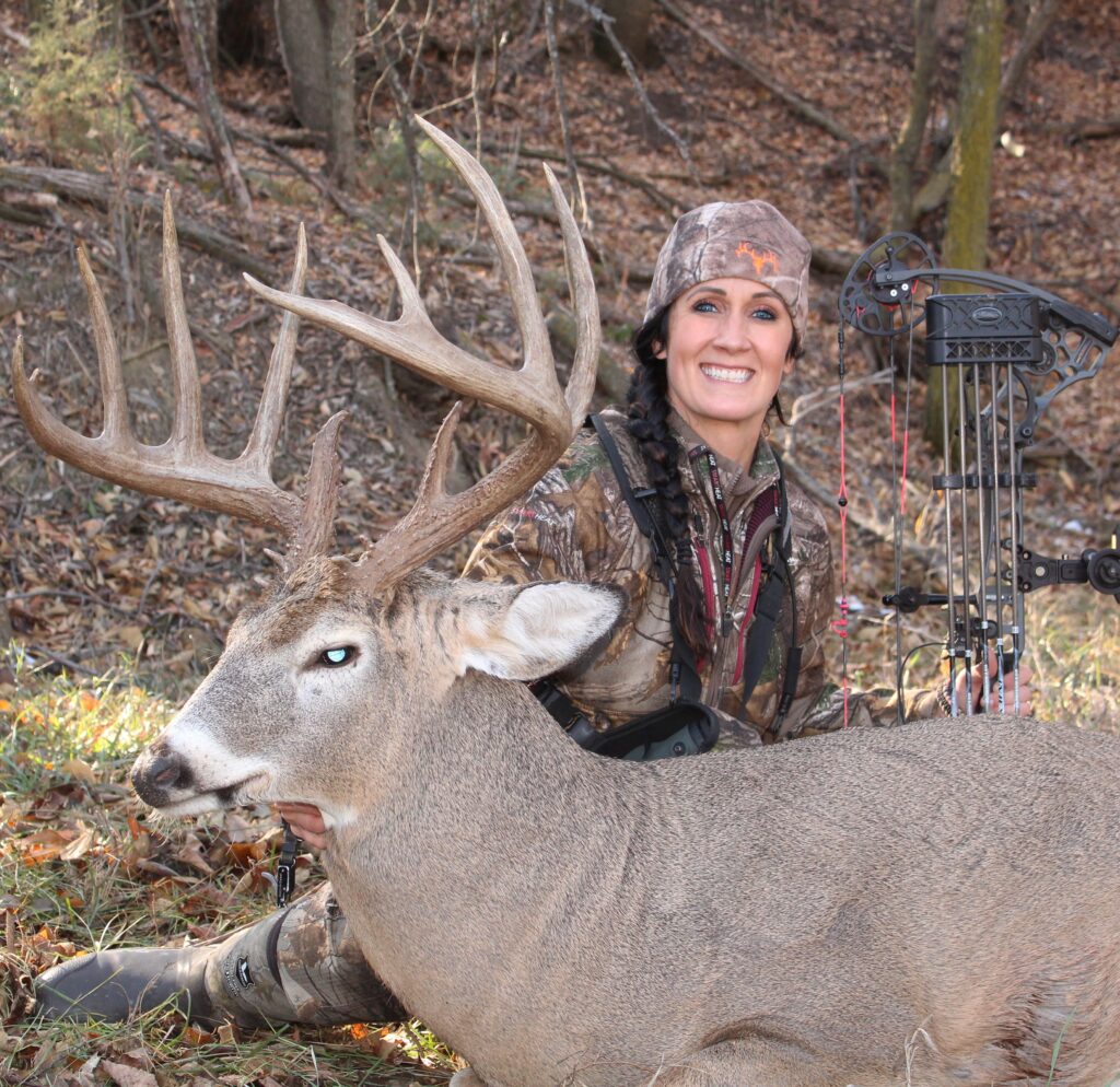 Trophy whitetail deer and woman hunter