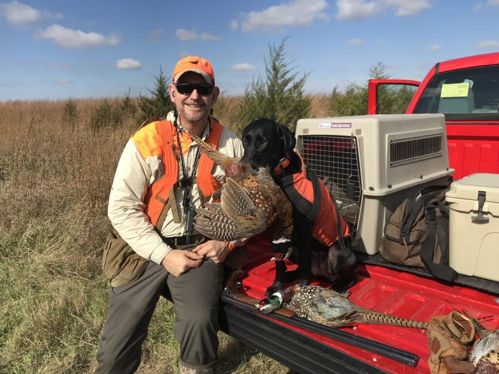 Matt Kucharski and his lab Nellie pheasant hunting