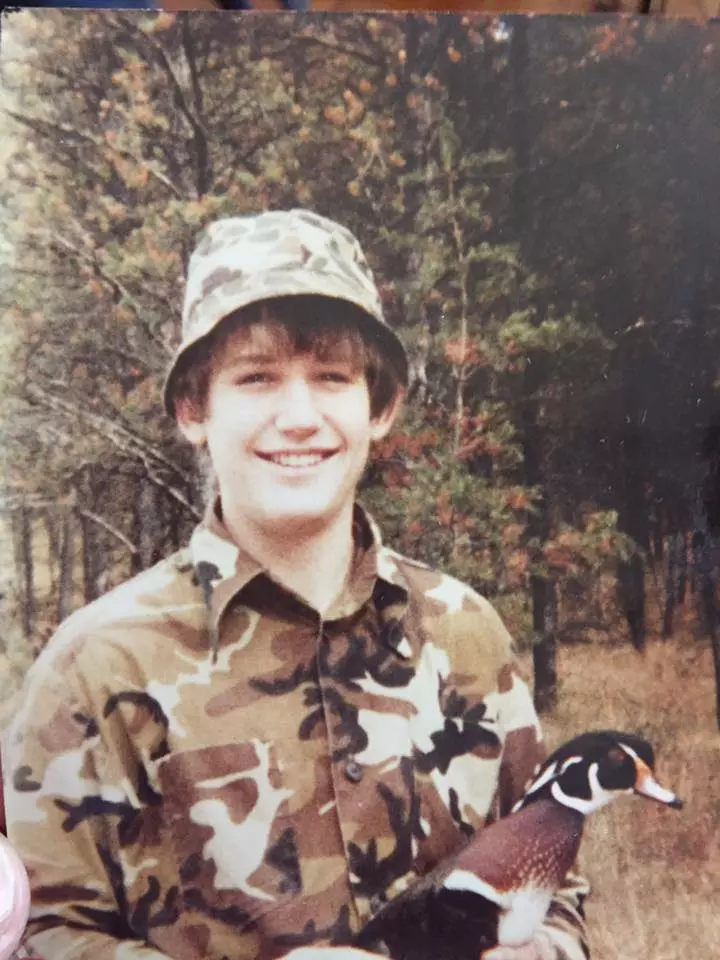 Young Matt Kucharski with wood duck