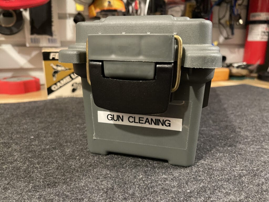 Plastic case with gun cleaning supplies