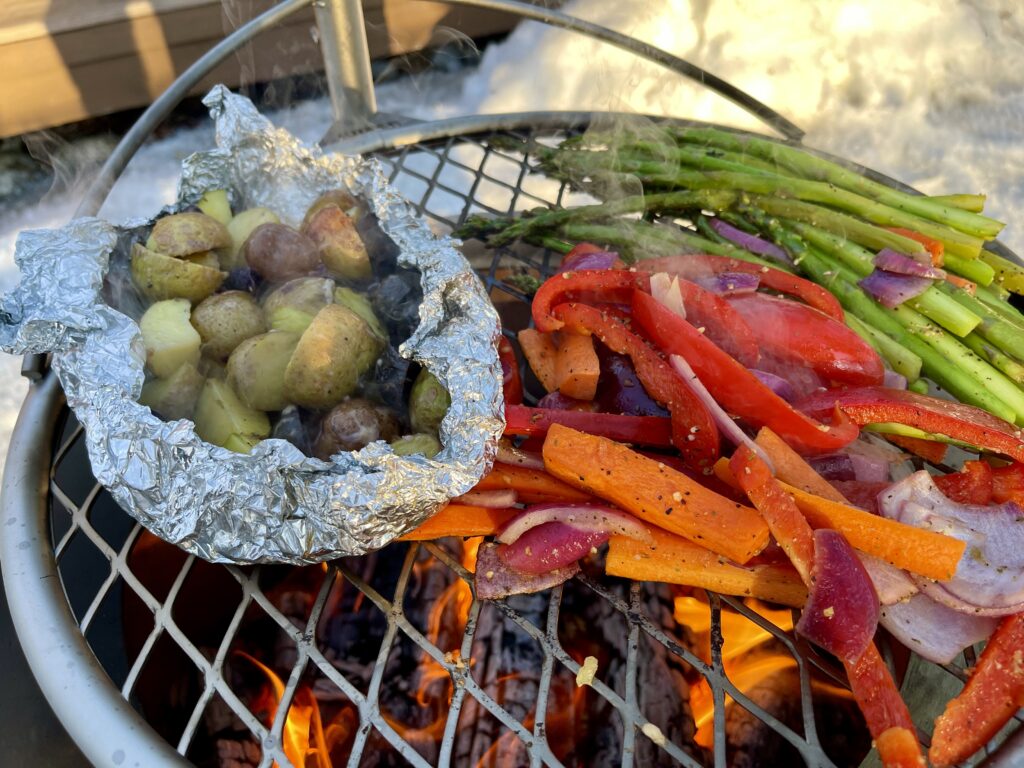 Cooking on the Outpost Grill and Breeo Y Series Fire Pit