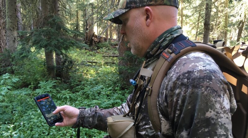 Hunter using onX Hunt App while elk hunting